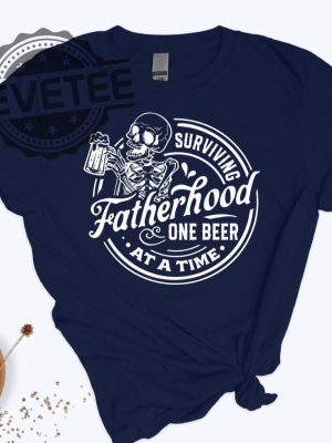 Surviving Fatherhood One Beer At A Time Shirt Fathers Day Gift revetee.com 2