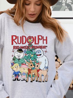 Rudolph The Red Nosed Reindeer Christmas Sweatshirt Rudolph Xmas Sweatshirt Rudolph The Red Nosed Reindeer 1964 Characters Shirt Rudolph The Red Nosed Reindeer Cartoon Shirt New revetee.com 2