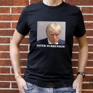 Never Surrender T Shirt Never Surrender Merchandise Trump Mugshot Merchandise Trump Mug Shot Merchandise Donald Trump Merchandise Trump T Shirts Donald Trump Mugshot Shirt revetee.com 2