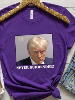 Never Surrender T Shirt Never Surrender Merchandise Trump Mugshot Merchandise Trump Mug Shot Merchandise Donald Trump Merchandise Trump T Shirts Donald Trump Mugshot Shirt revetee.com 3