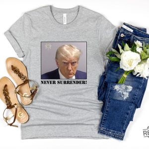 Never Surrender T Shirt Never Surrender Merchandise Trump Mugshot Merchandise Trump Mug Shot Merchandise Donald Trump Merchandise Trump T Shirts Donald Trump Mugshot Shirt revetee.com 6