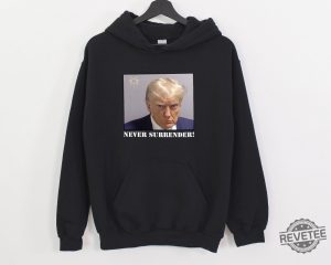 Trump Never Surrender Hoodie Never Surrender T Shirt Never Surrender Merchandise Trump Mugshot Merchandise Trump Mug Shot Merchandise Donald Trump Merchandise Unique revetee.com 2