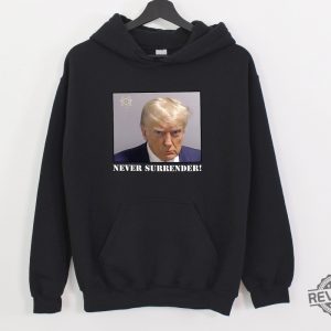 Trump Never Surrender Hoodie Never Surrender T Shirt Never Surrender Merchandise Trump Mugshot Merchandise Trump Mug Shot Merchandise Donald Trump Merchandise Unique revetee.com 2