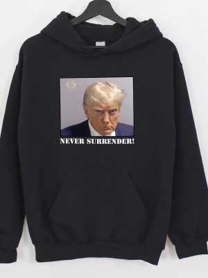 Trump Never Surrender Hoodie Never Surrender T Shirt Never Surrender Merchandise Trump Mugshot Merchandise Trump Mug Shot Merchandise Donald Trump Merchandise Unique revetee.com 2