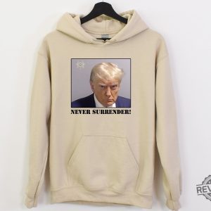 Trump Never Surrender Hoodie Never Surrender T Shirt Never Surrender Merchandise Trump Mugshot Merchandise Trump Mug Shot Merchandise Donald Trump Merchandise Unique revetee.com 3