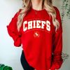 Karma Is the Guy On The Chiefs Sweatshirt Travis Kelce And Taylor Swift Shirt Kansas City Chiefs Era Sweatshirt trendingnowe.com 2