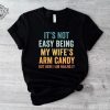 Its Not Easy Being My Wifes Arm Candy Shirt Husband Funny Tshirt Dad Joke Shirt Funny Shirt For Men Funny Gift For Dad Dad Birthday. Unique revetee 1