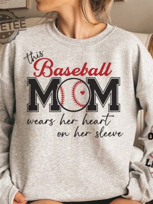 This Baseball Mom Wear Her Heart On Her Sleeve Personalized Sweatshirt Unique Baseball Mom Tees Hoodie T Shirt revetee 3