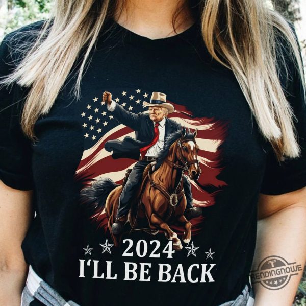 Donald Trump 2024 Shirt Trump Riding A Horse With The American Flag Cowboy Trump T Shirt Trump Shirt Sweatshirt Hoodie trendingnowe 1 1