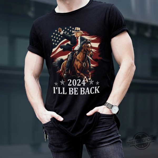 Donald Trump 2024 Shirt Trump Riding A Horse With The American Flag Cowboy Trump T Shirt Trump Shirt Sweatshirt Hoodie trendingnowe 2 1