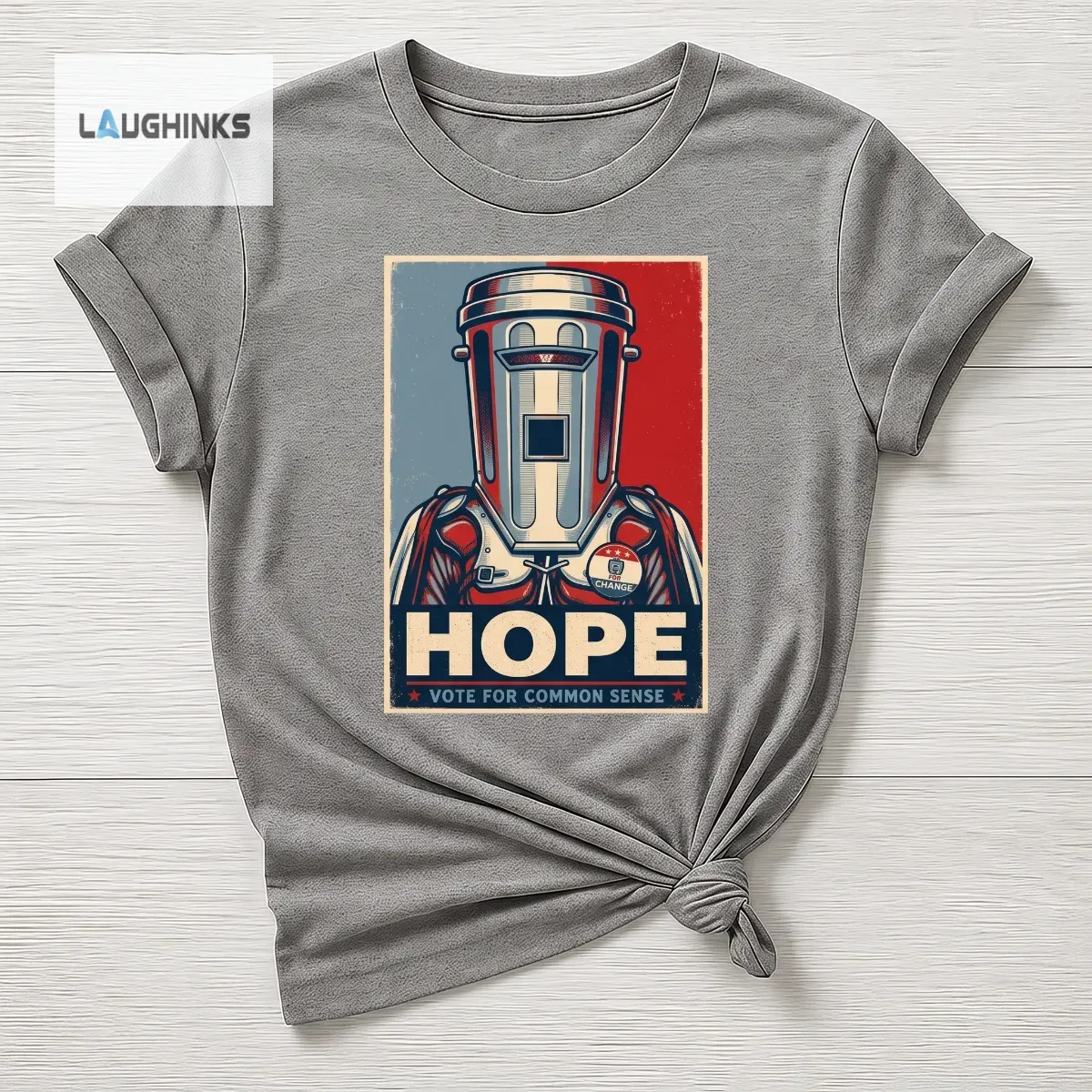 HOPE Vote for Common Sense Count Binface Clacton 2026 Tee 3 Flat lay of a grey t-shirt with a satirical political poster design featuring a bin-mask character.