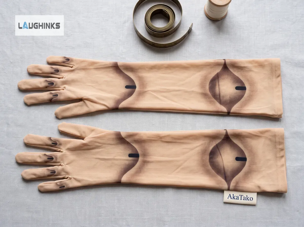 HyperReal Skin Tone Ball Jointed Doll Gloves for Halloween 7 Two beige gloves featuring ball-jointed graphics laid flat on a light grey textured background.
