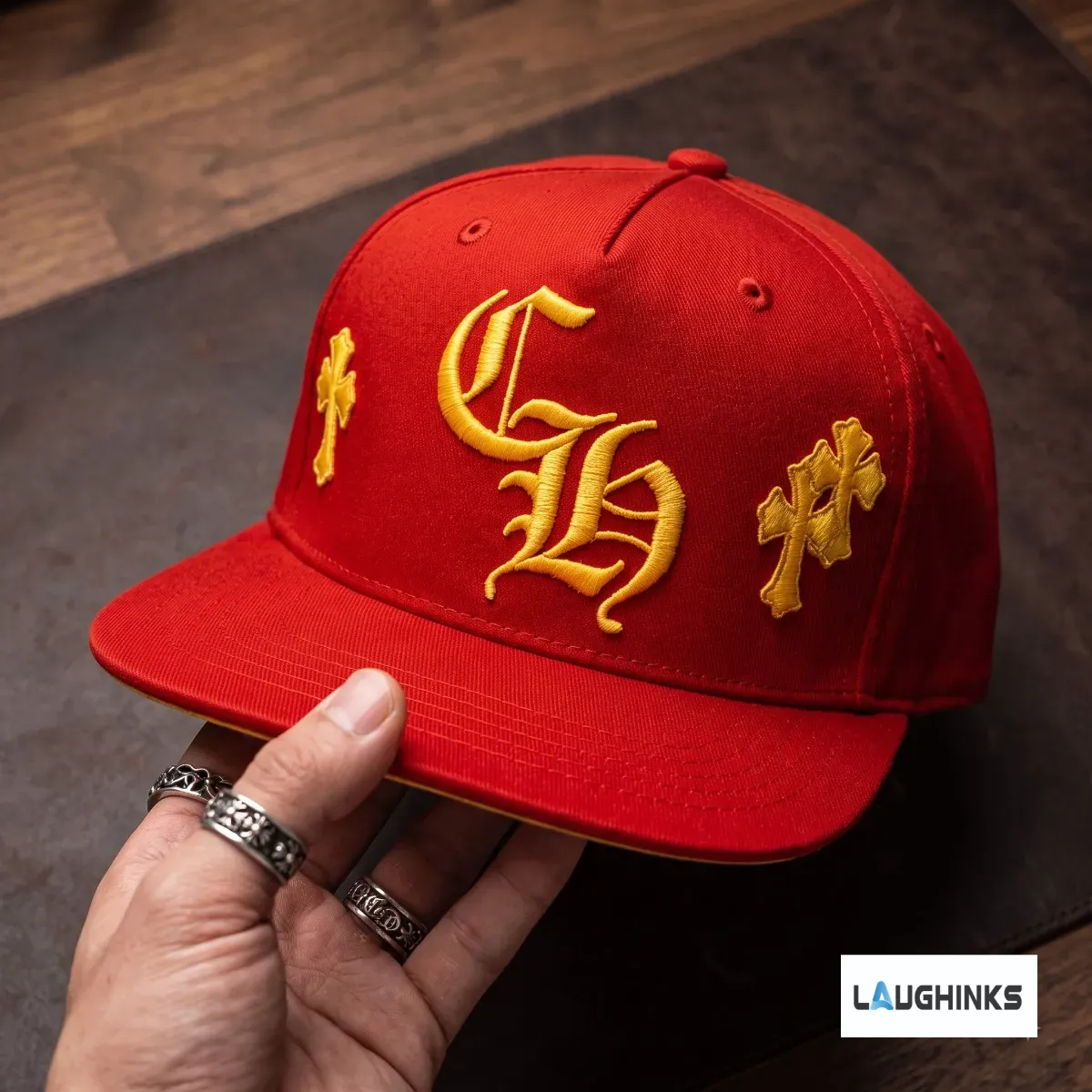 Replica Vini Jr Chrome Hearts Gothic Cross Yellow Embroidered Red Snapback Baseball Cap Hat 5 Angled view showing the detailed cross and gothic typography on the red hat.