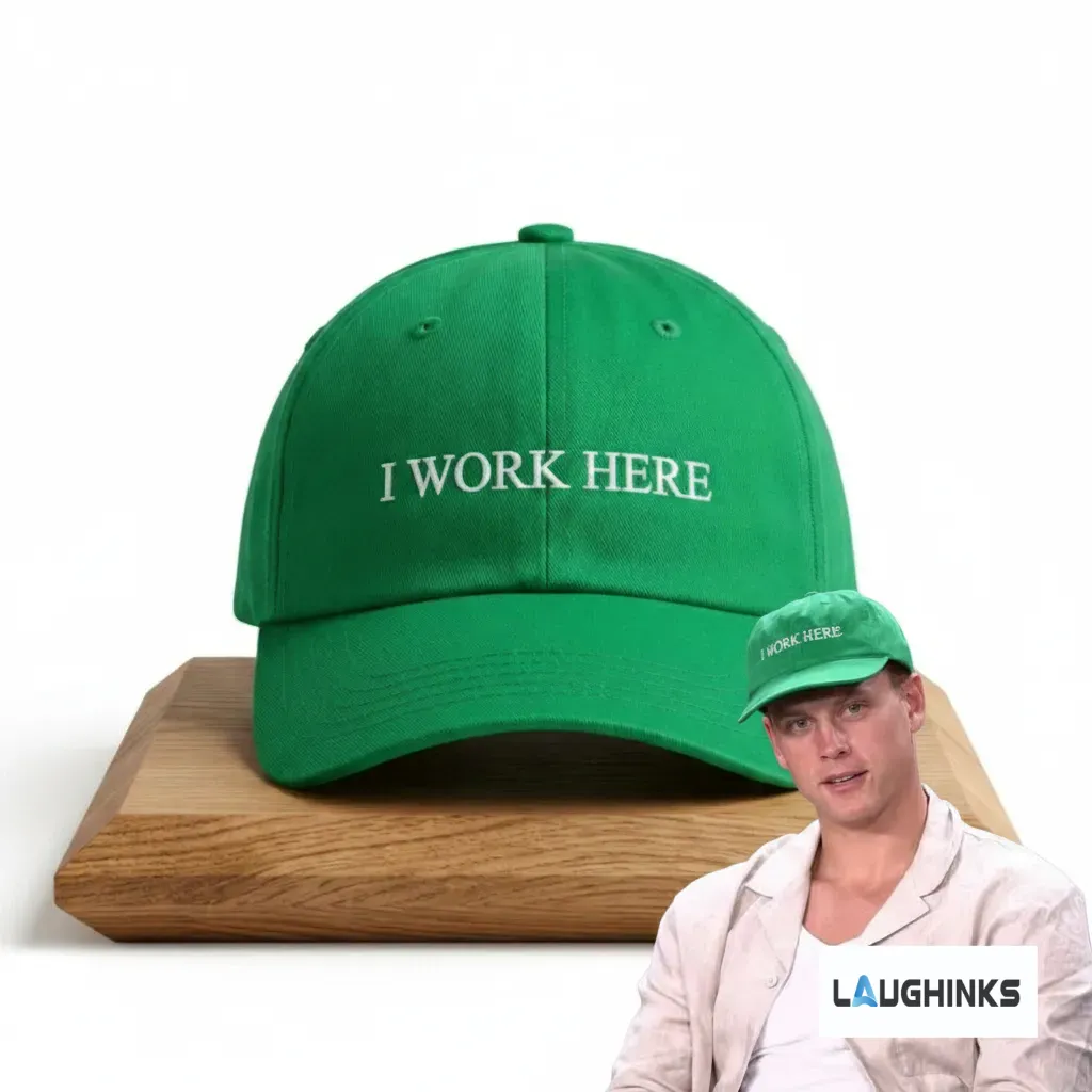 I Work Here Joe Burrow Cincinnati Bengals Green Embroidered Hat 4 Kelly green baseball hat with white embroidery saying I WORK HERE, styled on a wooden base with a Joe Burrow photo reference.