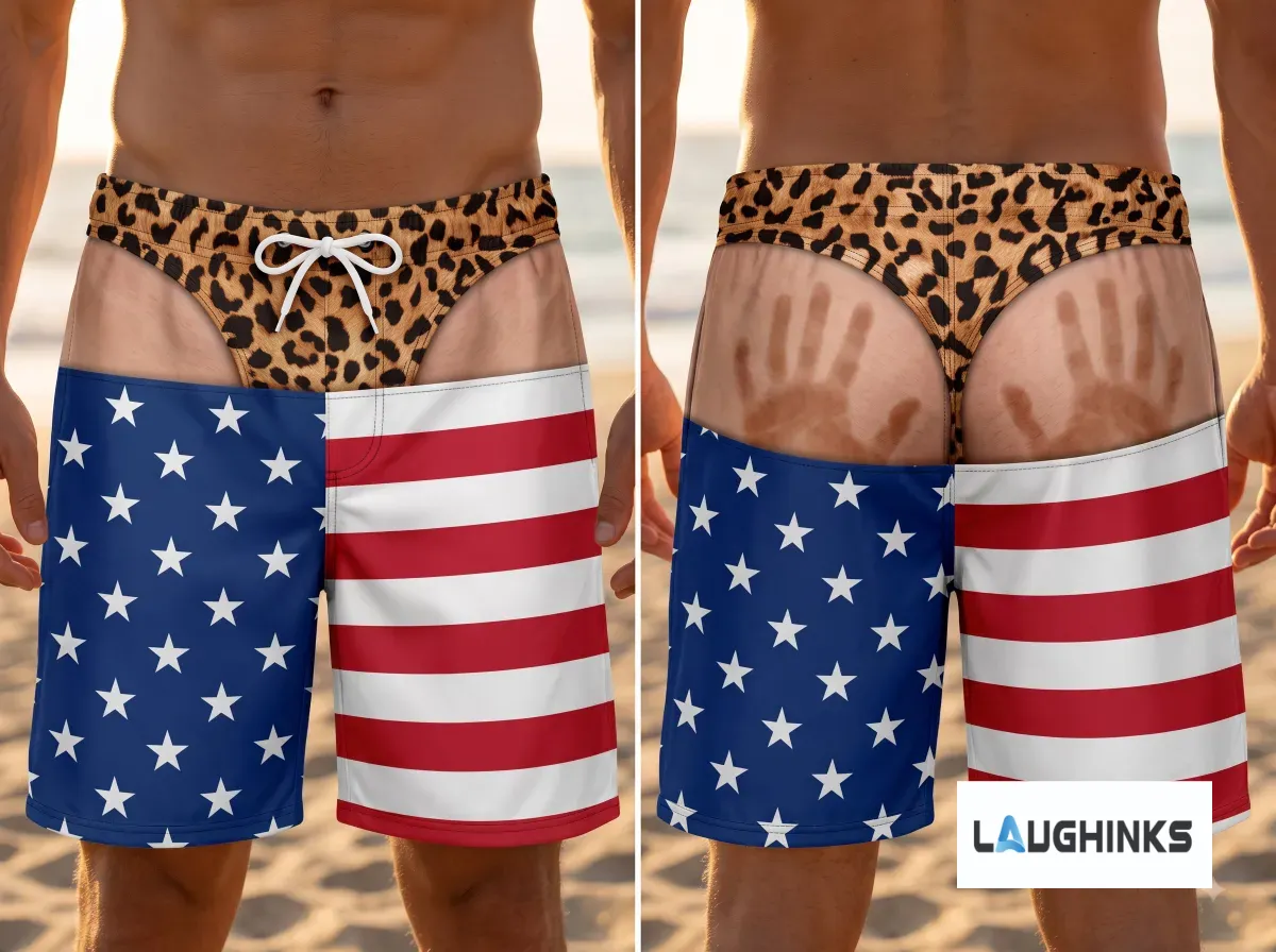 American Flag Leopard Print Funny Handprint Swim Trunks AOP Hawaiian Shorts for Men 4 Front view of American flag and leopard print swim trunks with white drawstring, worn by a man at the beach.