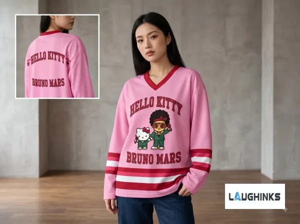 Top down flat lay of the Hello Kitty Bruno Mars hockey jersey set with sewing tools on wood.